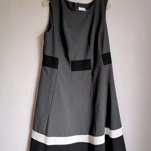 Calvin Klein gray color block dress with white & black stripes at bottom.